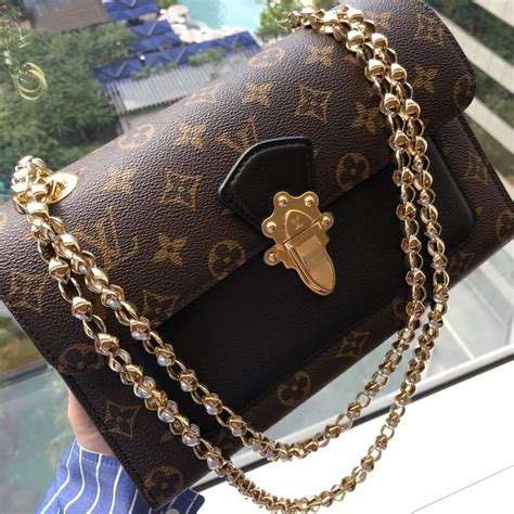 louis vuitton bag with gold chain|Louis Vuitton book chain wallet.